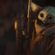 Baby Yoda marvelling at a massive chunk of meat.